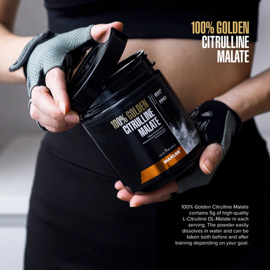 Person holding a container of 100% Golden Citrulline Malate supplement with text on it.