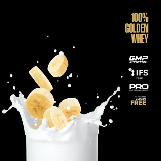 Bananas in a glass of milk with '100% Golden Whey' branding and certification logos on a black background.