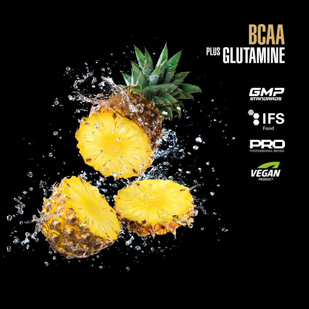 Pineapple slices with water droplets on a black background, featuring certification logos for BCAA plus Glutamine.