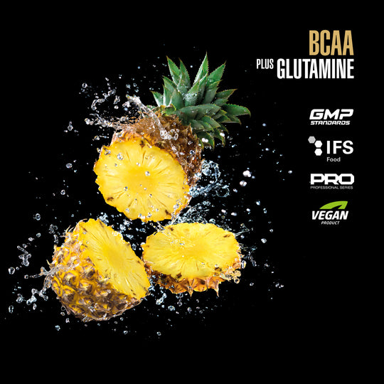 Pineapple slices with water droplets on a black background, featuring certification logos for BCAA plus Glutamine.