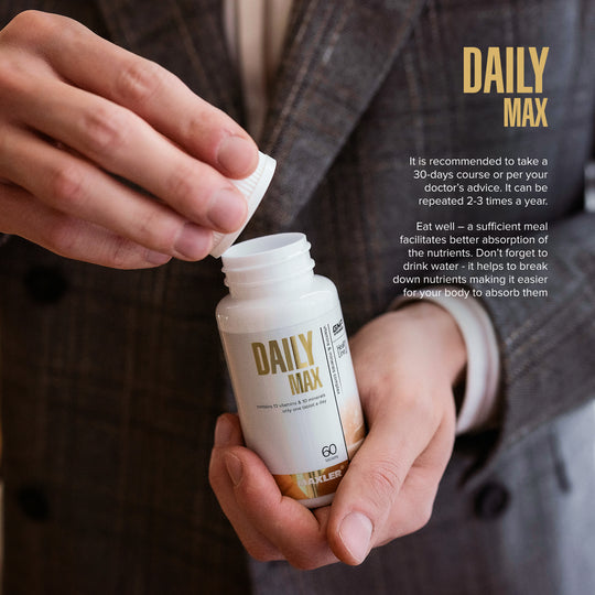 Person holding a 'Daily Max' supplement bottle with text about usage instructions.