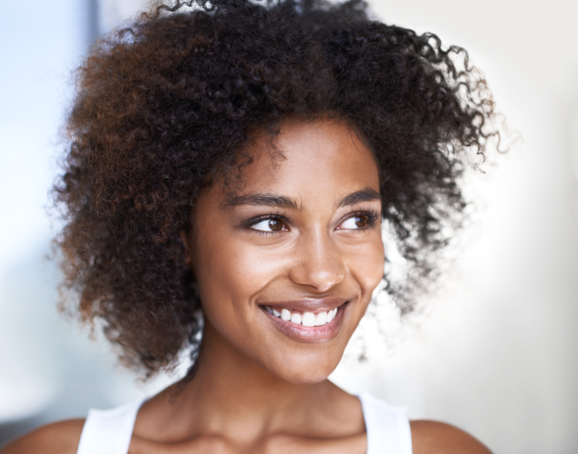 A photo of a smiling woman.