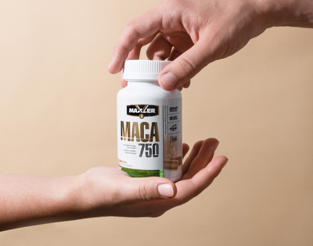 A photo of two hand holding MACA 750 bottle.
