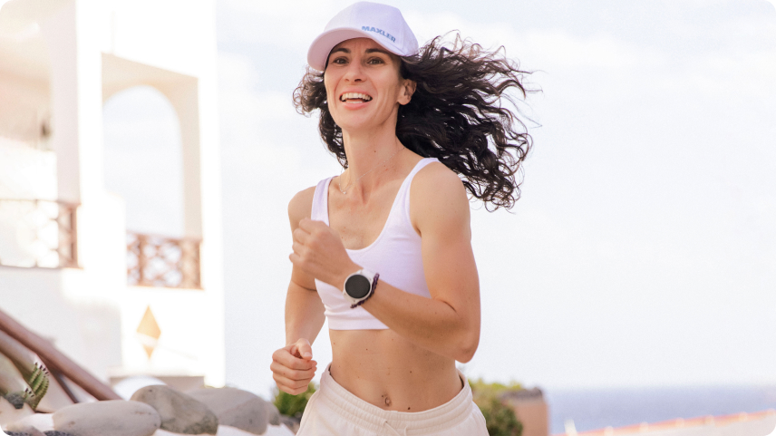 A woman running in Maxler branded clothing