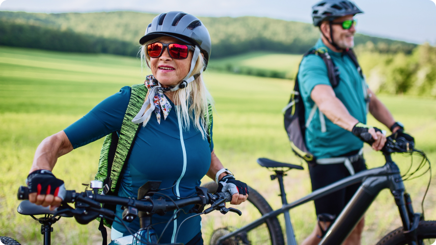 elderly people riding bicycles